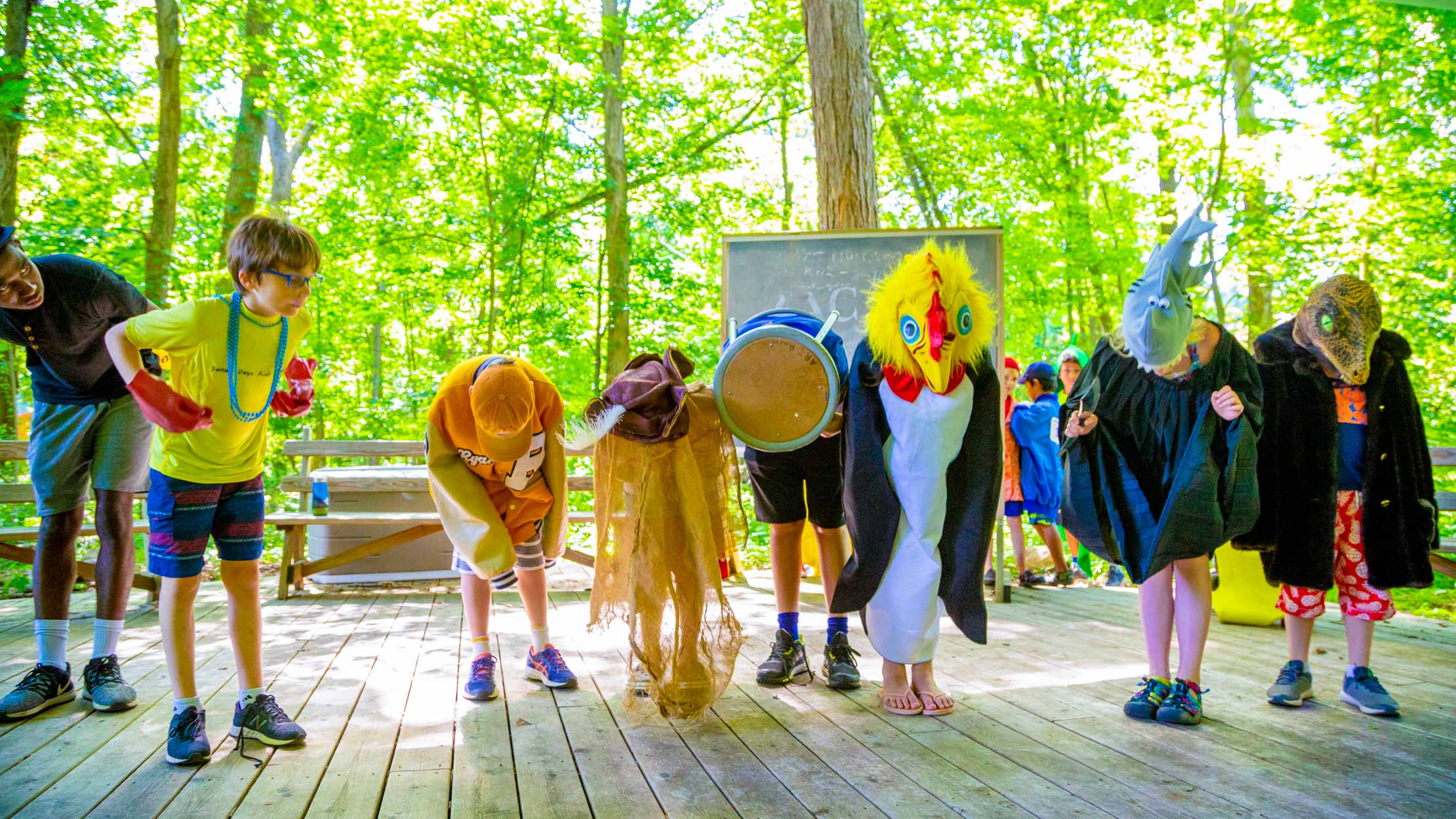 Campers in costume bowing after a skit