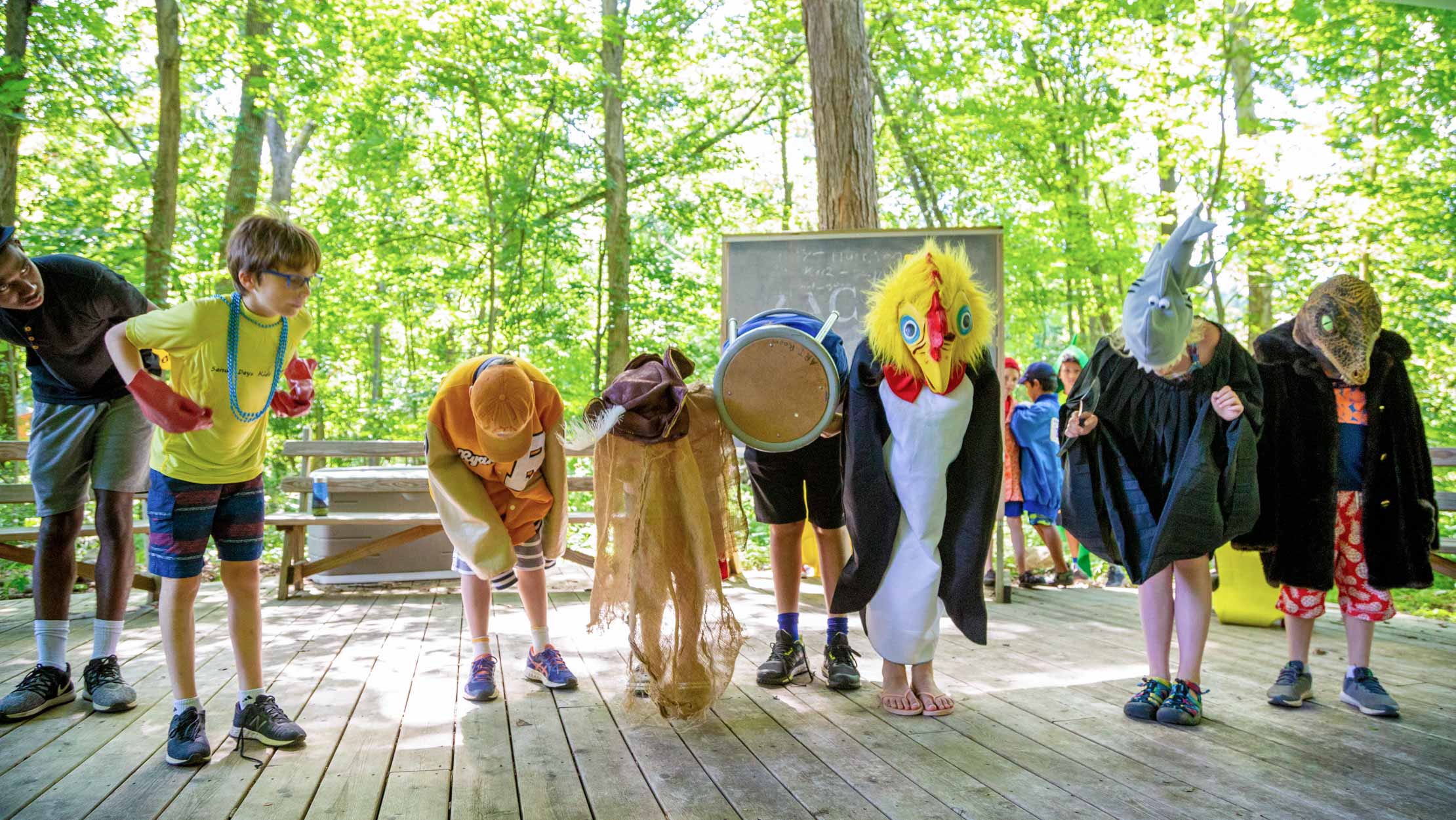 Campers bowing after a performance