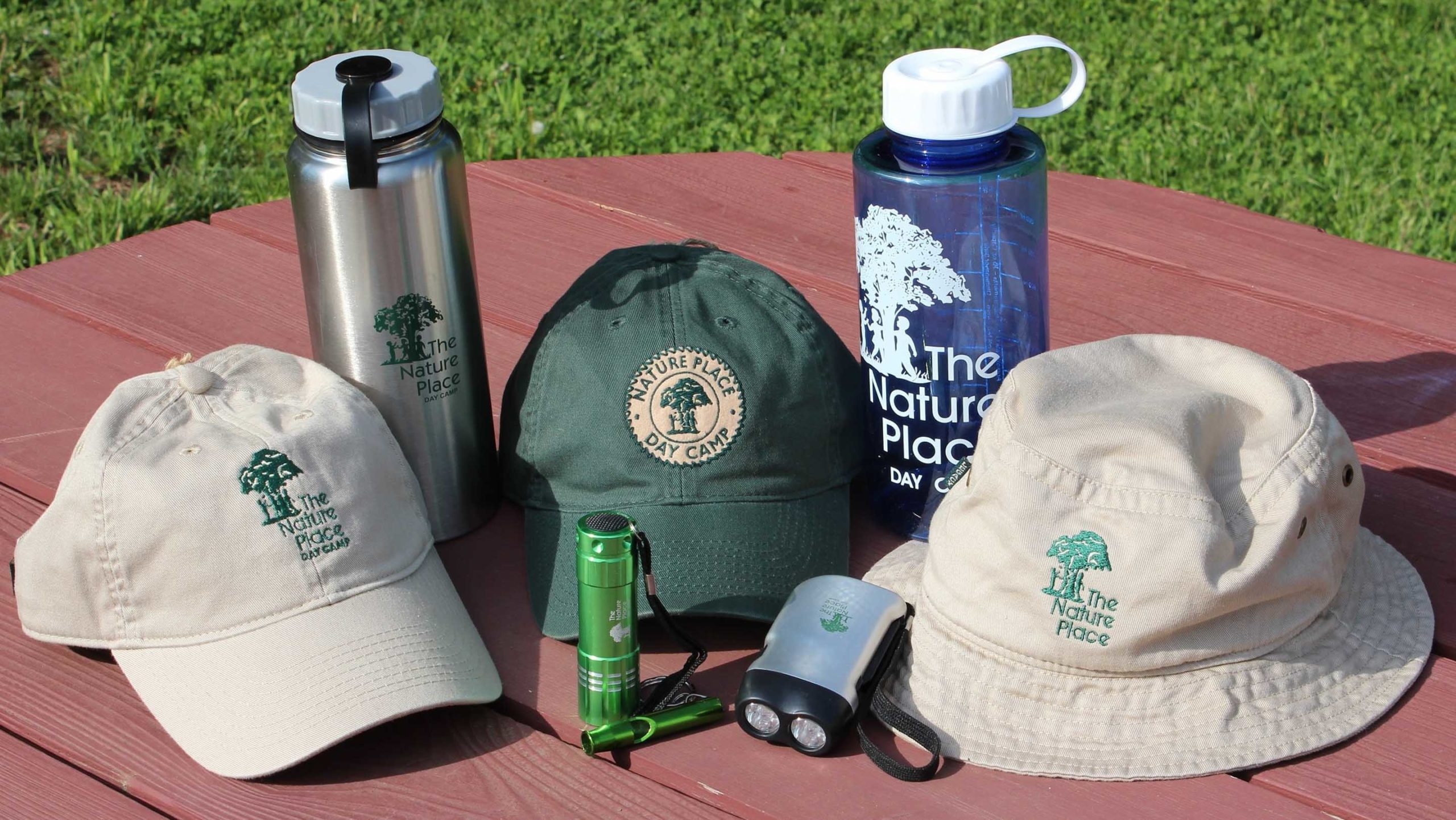 Nature Place Day Camp hats and water bottles