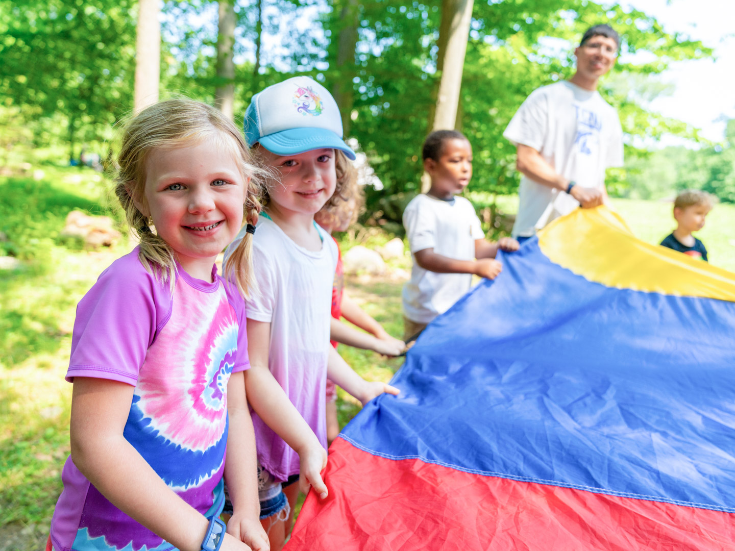 Campers playing parachute game